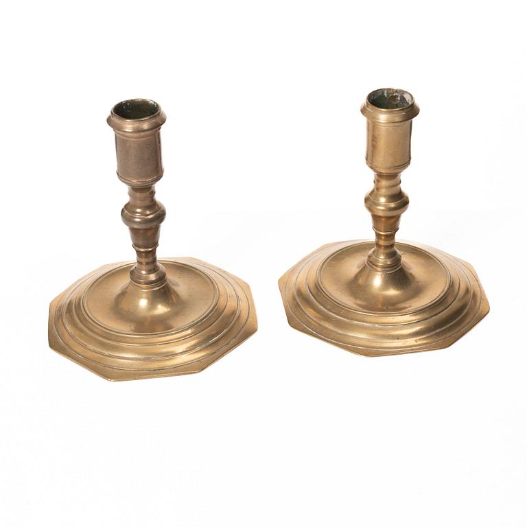 A pair of Swedish late baroque brass candlesticks, mid 18th century.
