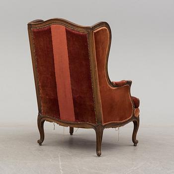 A 19th century rococo style easy chair.