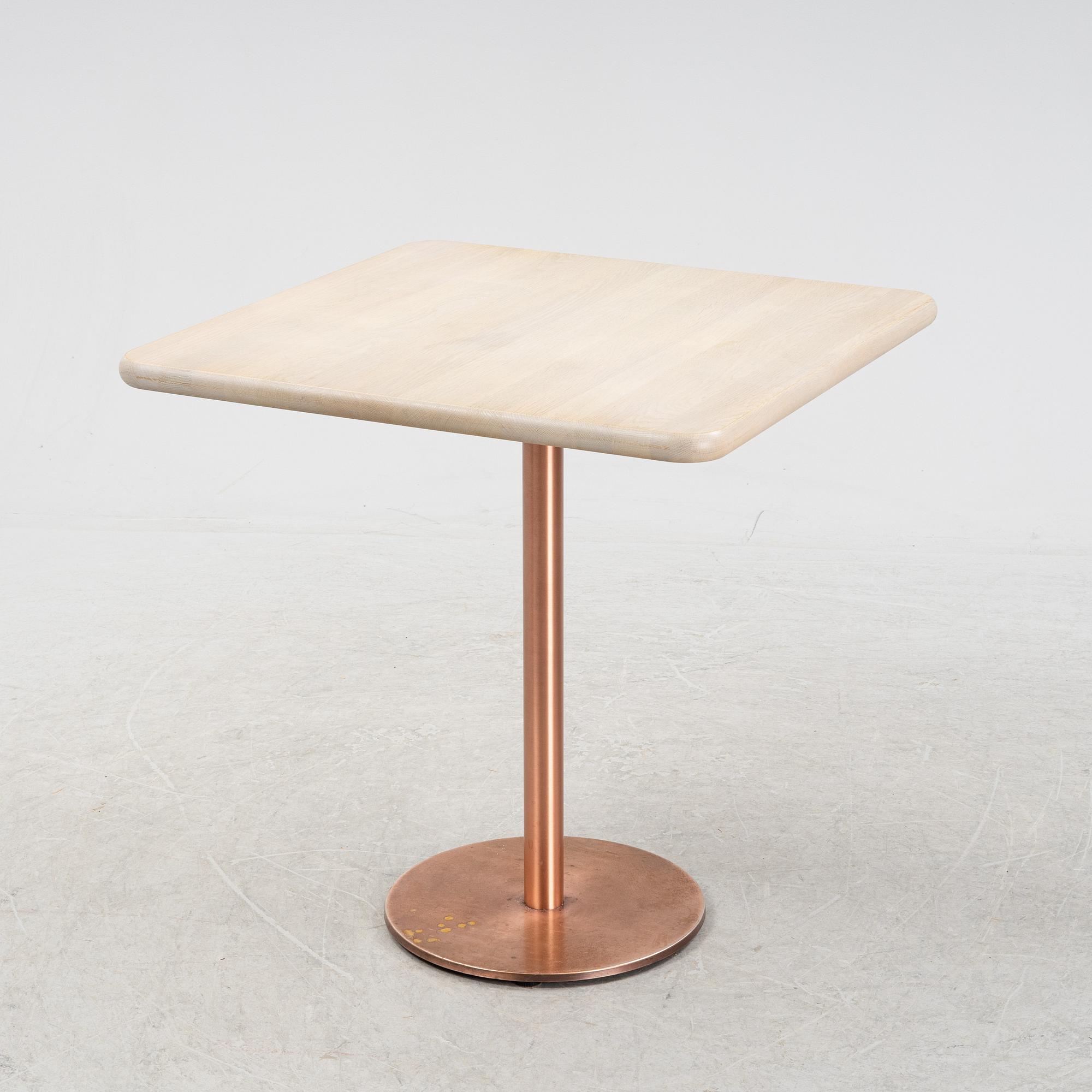 A steel and oak table by Jonas Lindvall Stolab, 2011.
