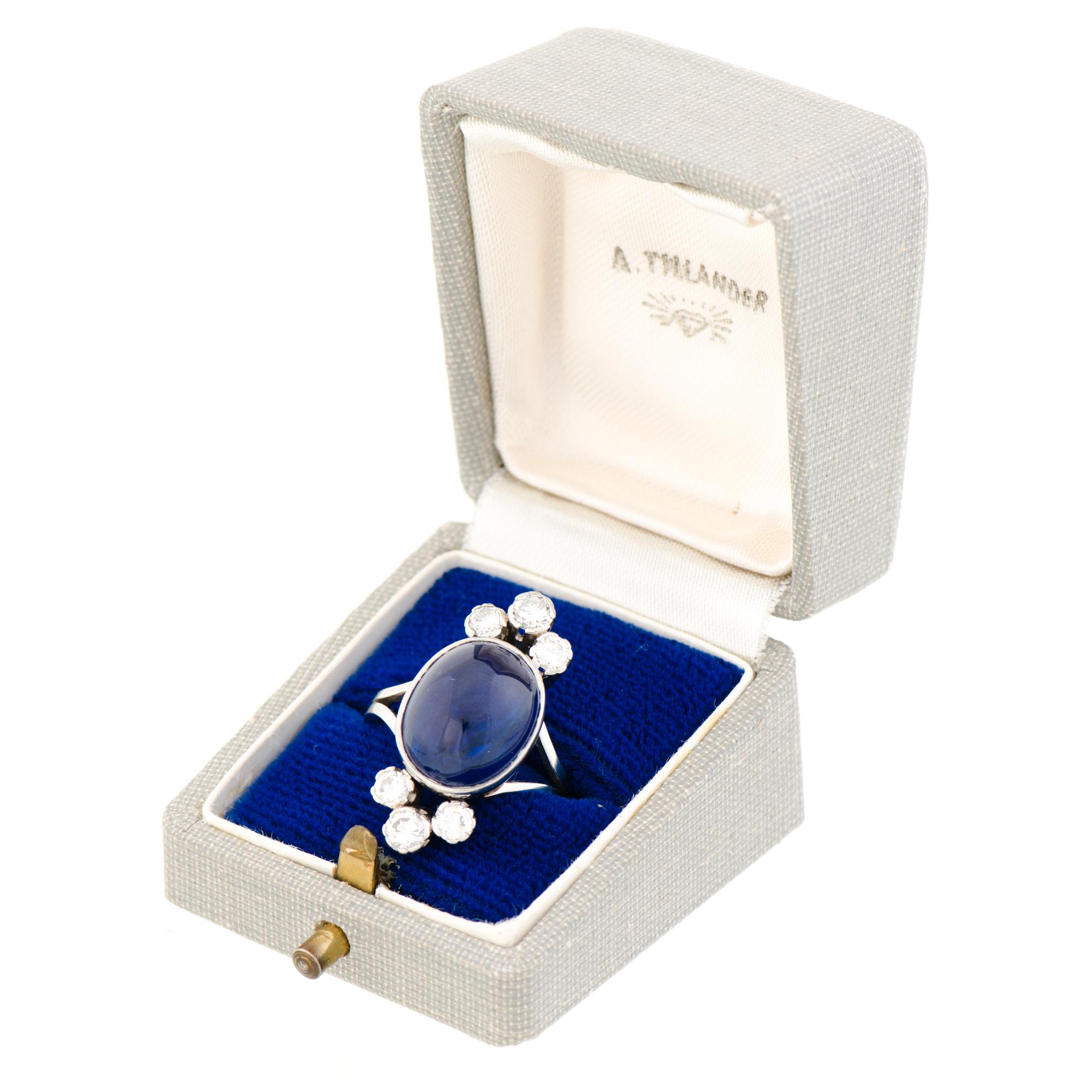 A RING, cabochon cut sapphire, brilliant cut diamonds, platinum. A. Tillander.