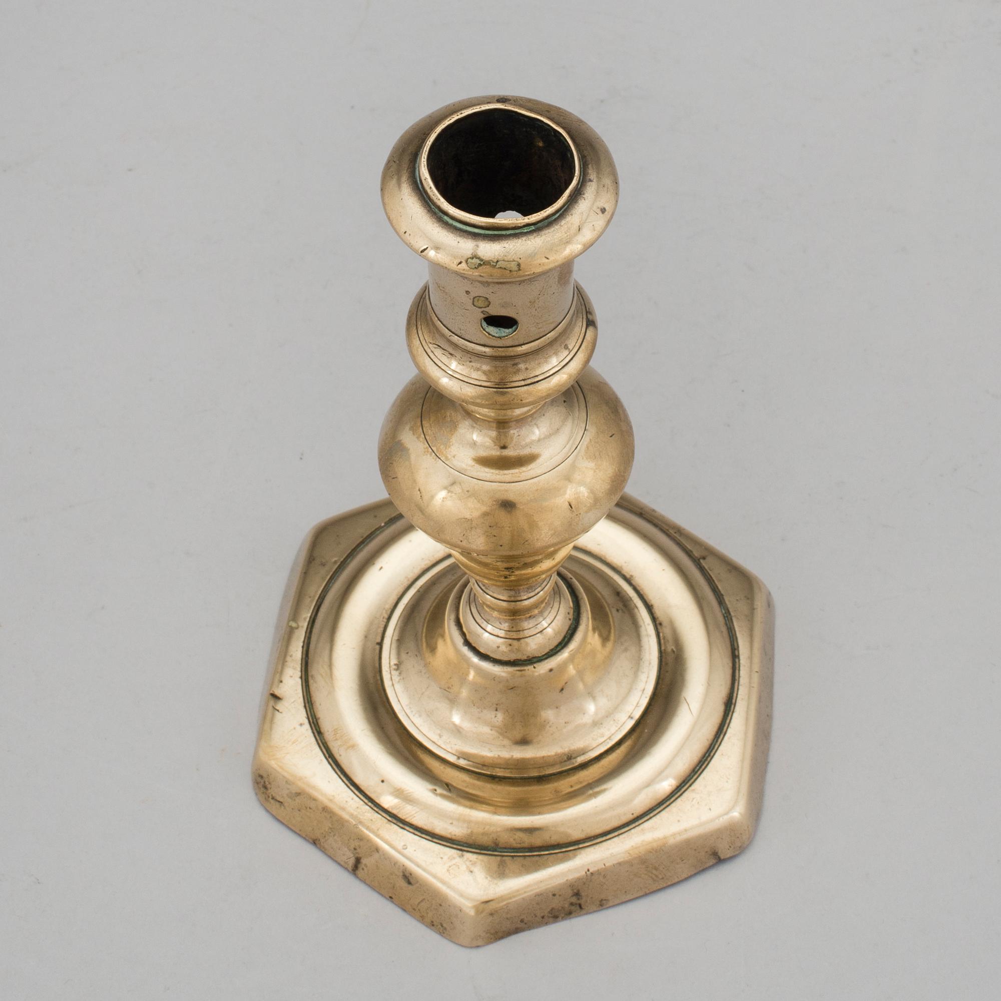 A BRONZE BAROQUE CANDLESTICK, 17th century.