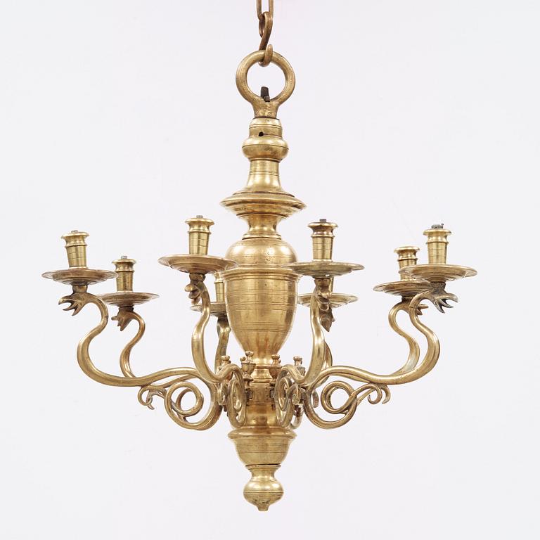 A 19th century eight-light brass chandelier in the manner of Hans Rogiers van Harelbeke.