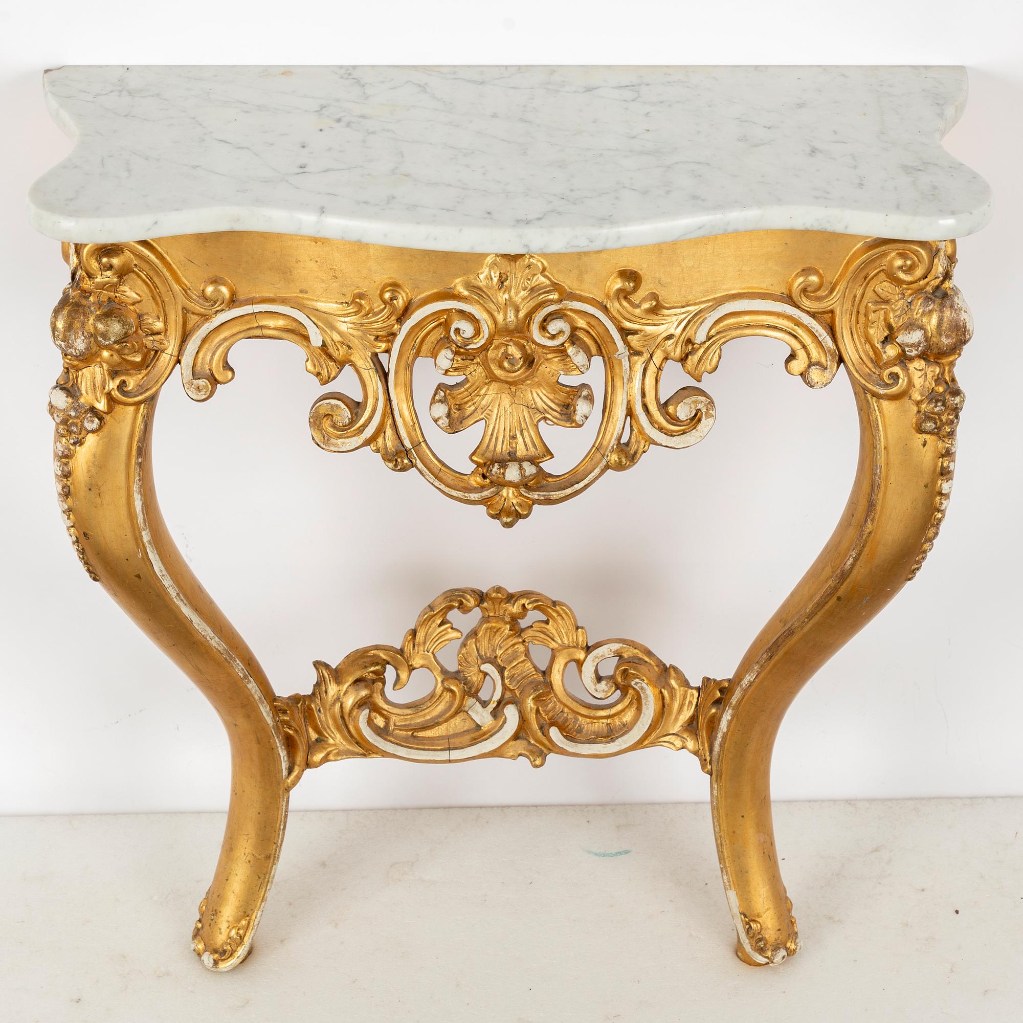 A Rococo revival mirror and a console table, second half of the 20th Century.