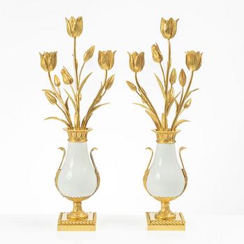 A pair of three light porcelain and gilt bronze three-branch Louis XV-style candelabra, mid 19th century.
