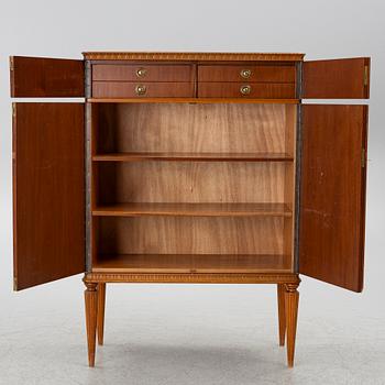 A cabinet, around the mid-20th century.