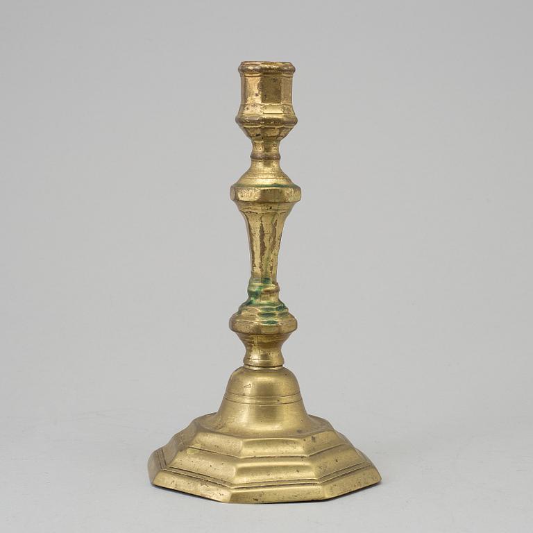 A 18th century bronze candlestick.