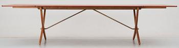 A Hans J Wegner teak and oak sabre leg dinner table by Andreas Tuck, Denmark 1950-60's.