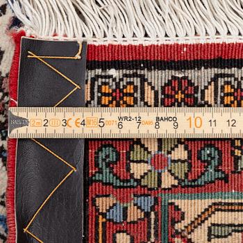 An oriental rug, approx. 238 x 174 cm.