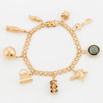 CHARM BRACELET, 18K gold with 9 charms.