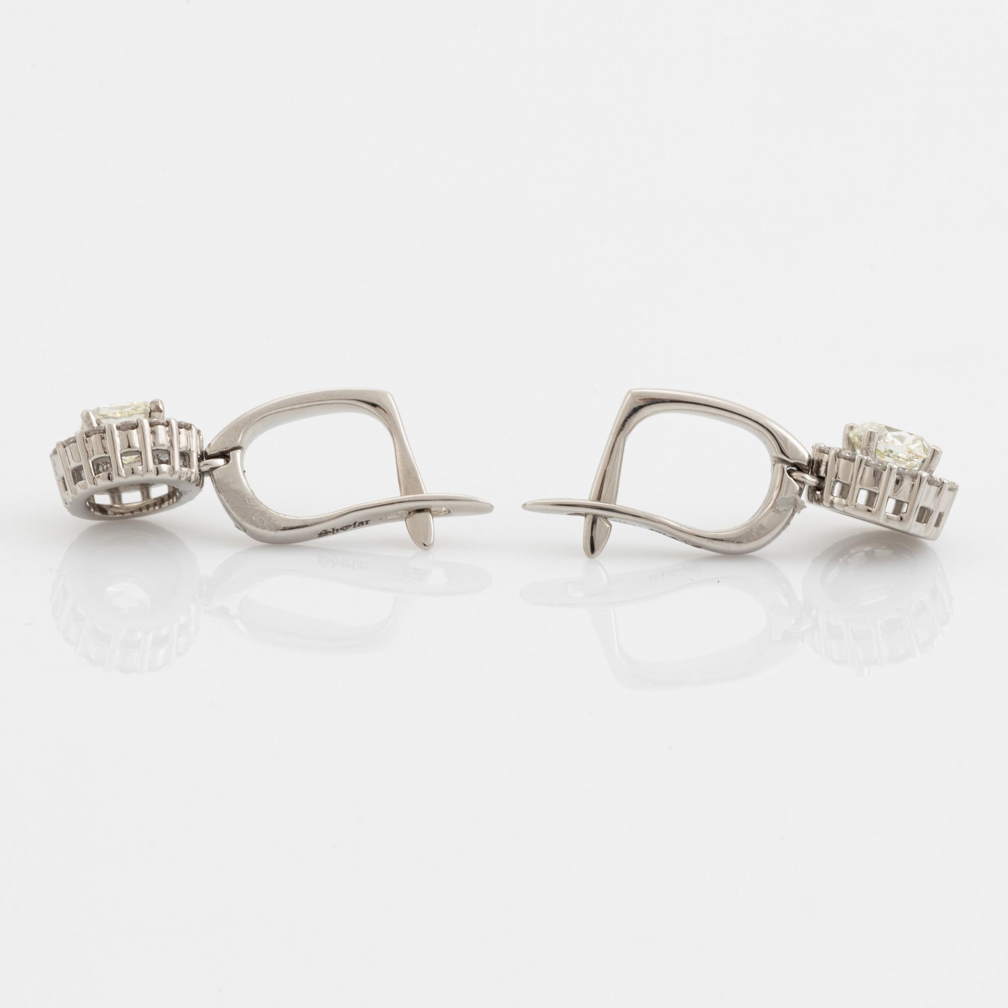Cushion cut diamond earrings.