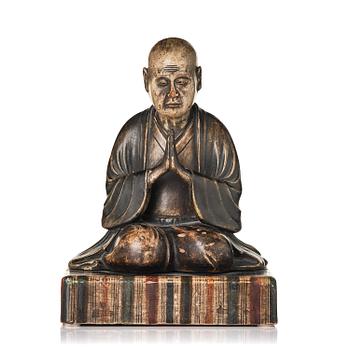 1256. A painted and lacquered wooden sculpture of a monk, Japan, 19th century.