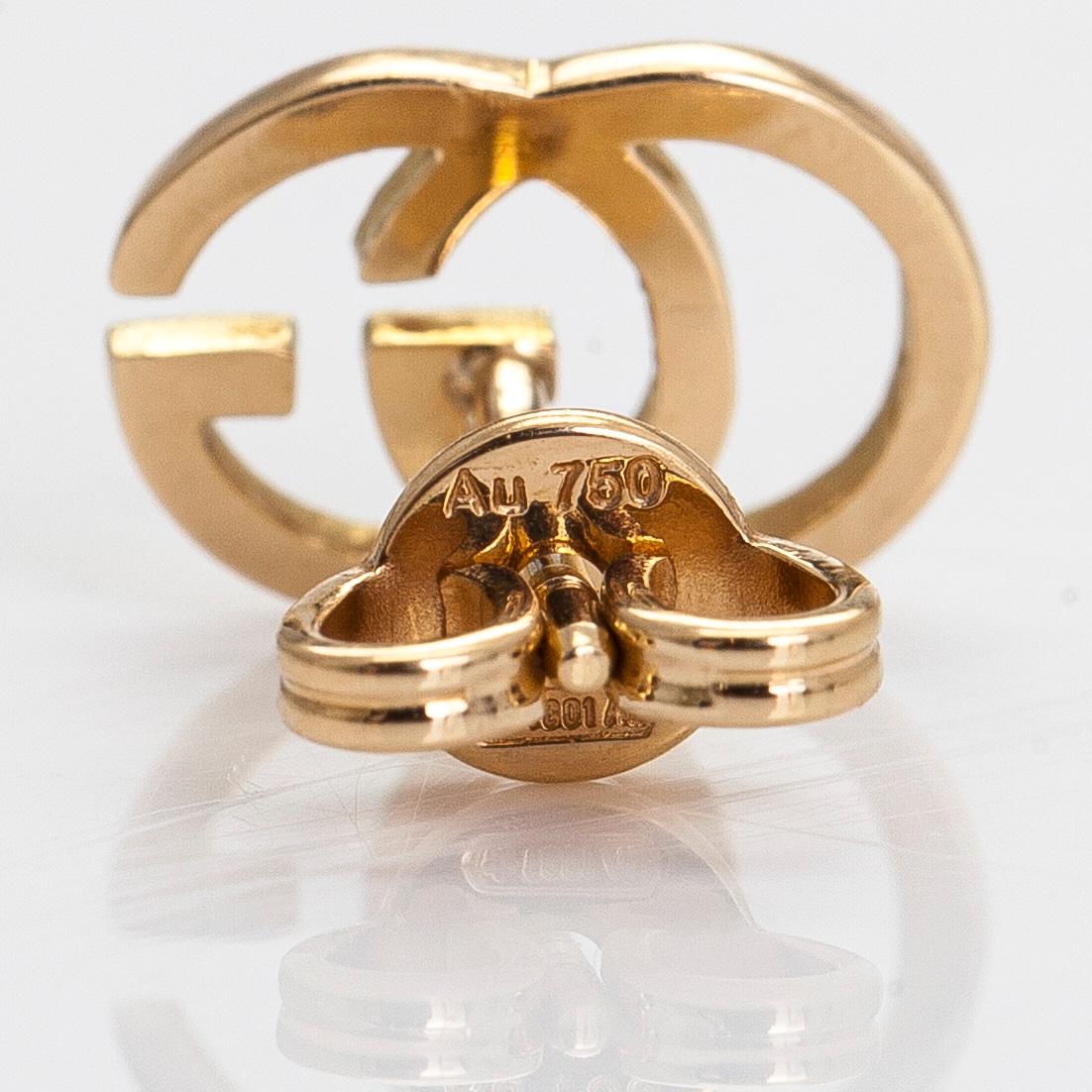 Gucci, a pair of 18K gold "GG Running" earrings.