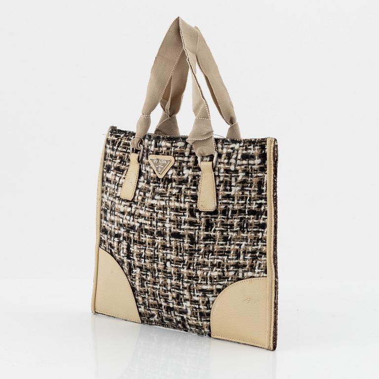 Prada, a tweed and leather bag.