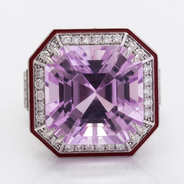 A 14K gold ring with kunzite and diamonds.