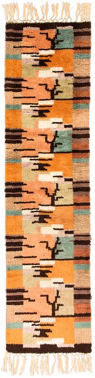 Tuntematon taiteilija, keinutuolimatto, 1930-luku. Noin 190x48 cm.