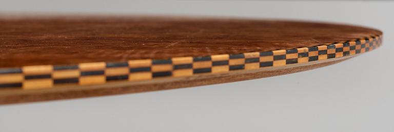 A Josef Frank mahogany and burrwood dining table, Svenskt Tenn, model 1020, checkered edges.