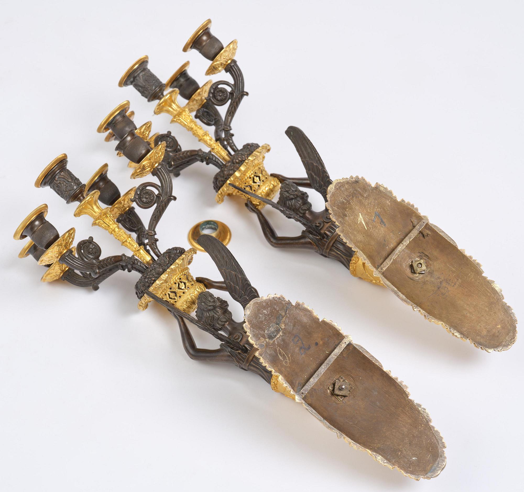 A pair of French Empire five-branch gilt and patinated bronze appliques, first part 19th century.