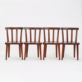 Axel Einar Hjorth, a set of four stained pine 'Utö' chairs, Nordiska Kompaniet Sweden 1930's.