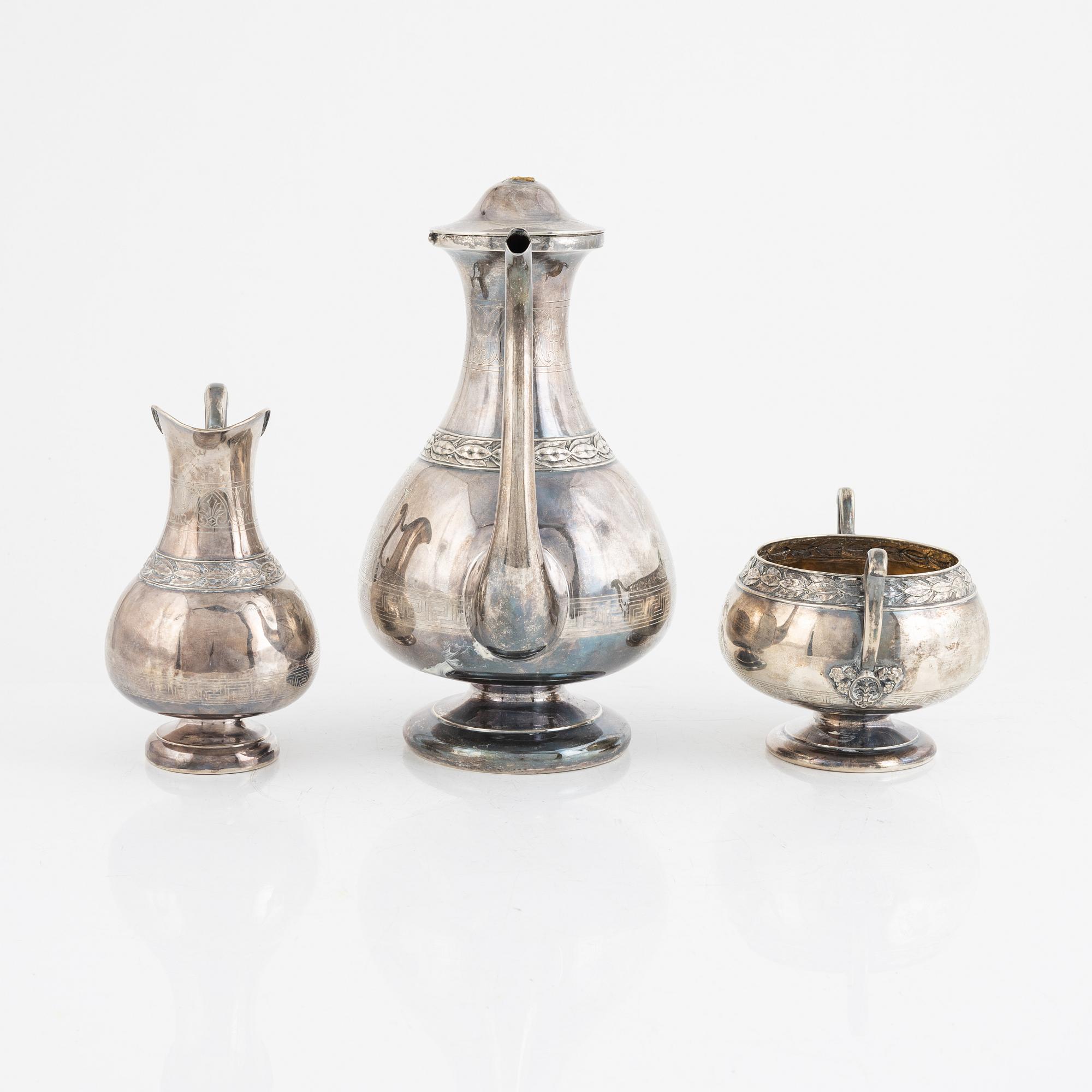 A Swedish Silver Coffee Pot, Creamer and Sugar Bowl, marks of GAB, Stockholm 1875-1897, and GT Folcker 1875.