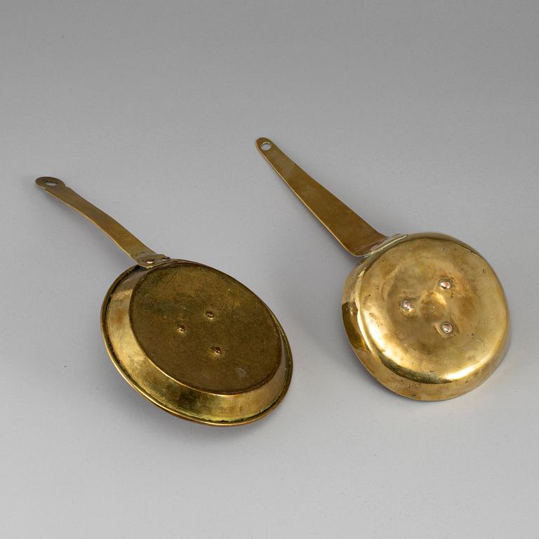 Two 18th century brass night lights.