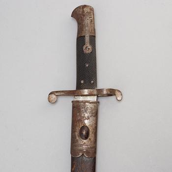 A hunting sword and two bayonets with scabbards.