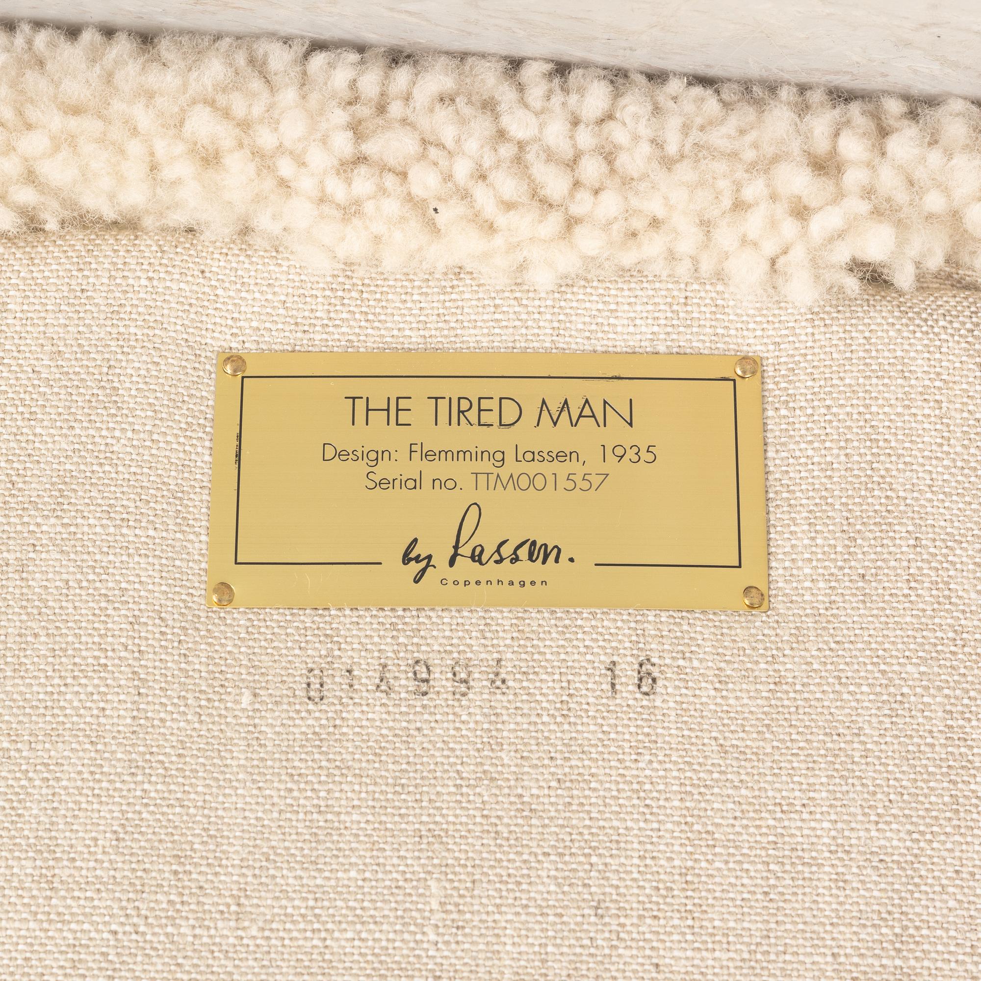 A 'The tired man' lounge chair with stool by Flemming Lassen by Lassen, designed 1935.