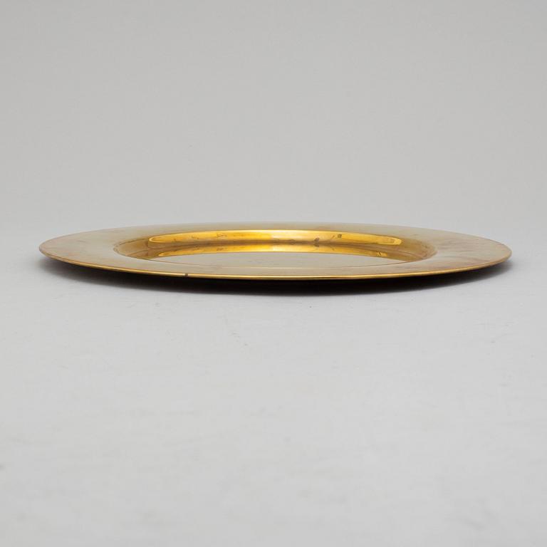 12 brass plates by Stelton, Denmark, second half of the 20th century.