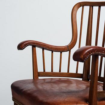 Otto Schulz, a Swedish Modern stained beech and cognac coloured leather armchair.