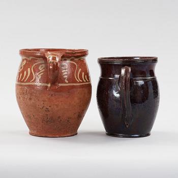 two earthenware pots from the 19th century.