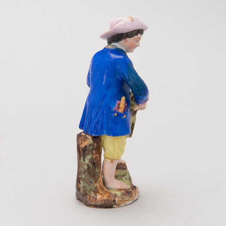 A MID 19TH CENTURY RUSSIAN POPOV FACTORY PORCELAIN FIGURINE.