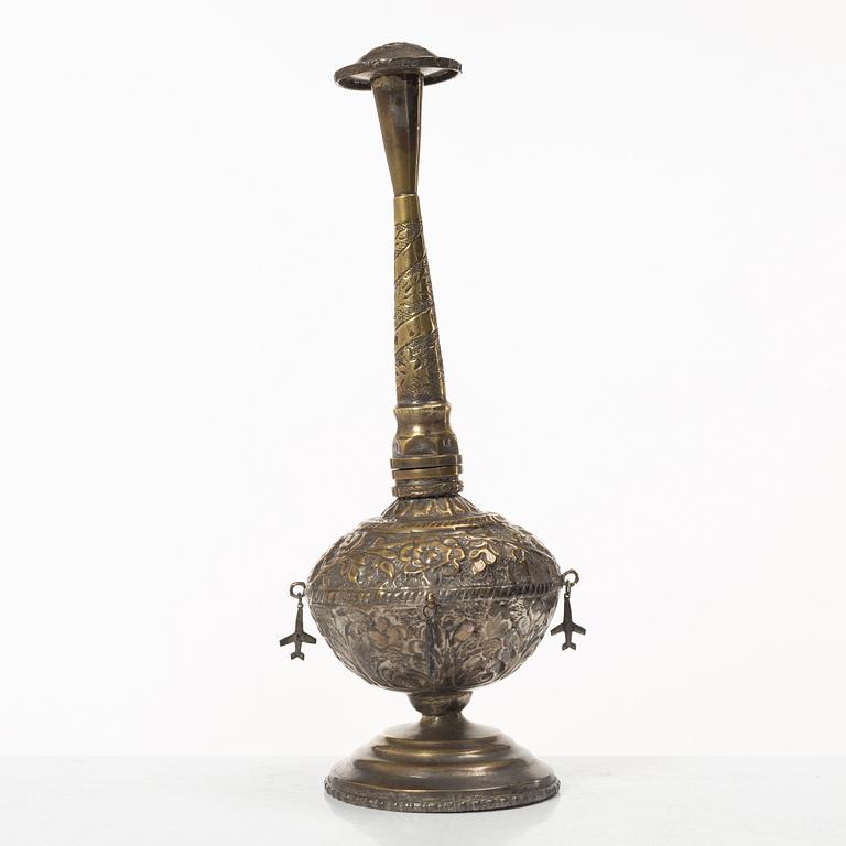 An 20th century british Raj repoussé metal rosewater sprinkler.
