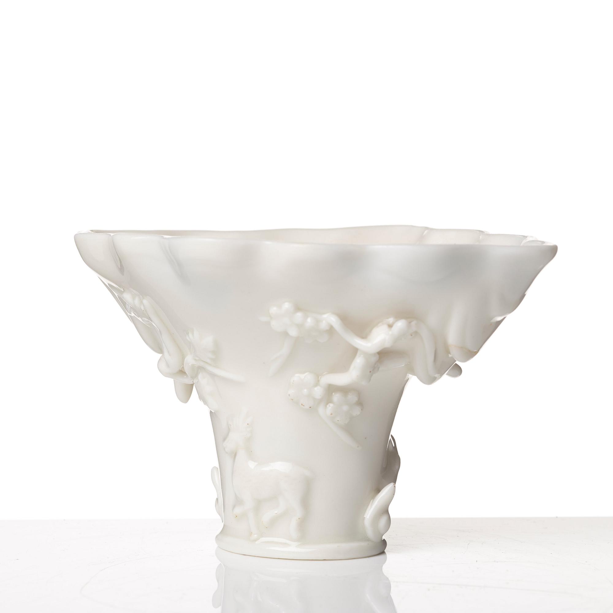 A blanc de chine rhinoserous libation cup, Qing dynasty, Kangxi (1662-1722).