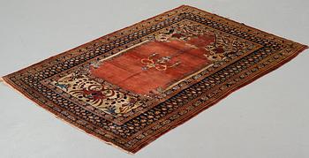 A rug, an antique silk Heriz, ca 166,5-170 cm x 116-120 cm.