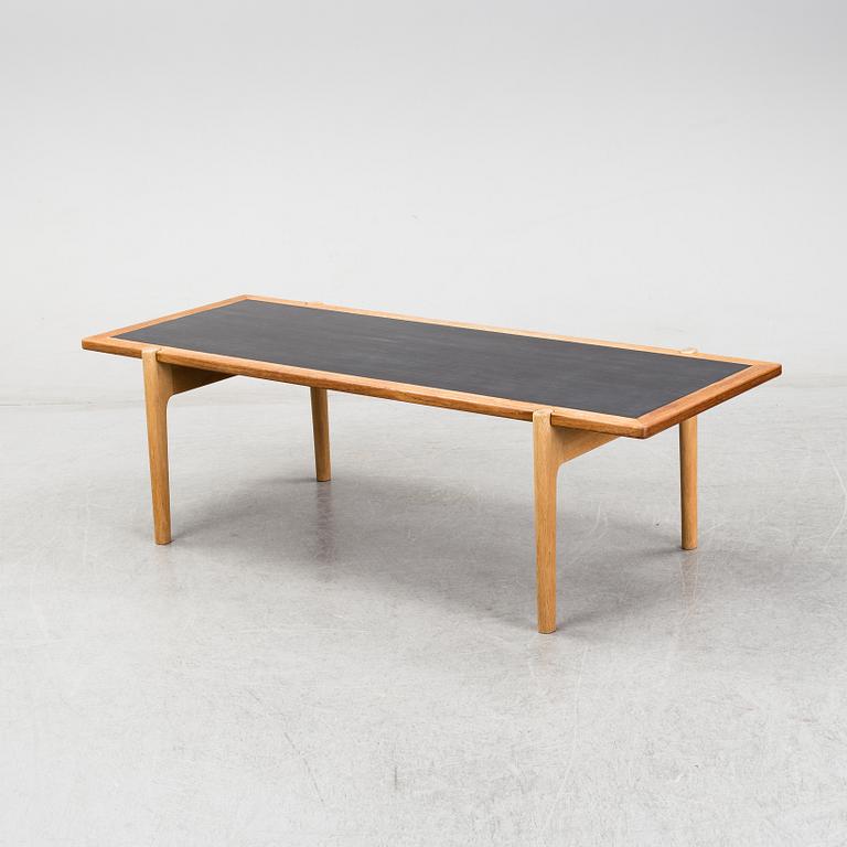 A model JH 575 coffee table by Hans J Wegner for Johannes Hansen.