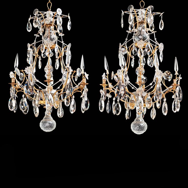 A pair of Swedish Rococo 18th century six-light chandeliers by Olof Westerberg dated 1789 and 1790.