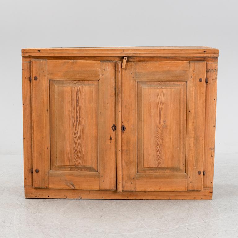 A 19th Century pine cabinet.