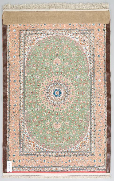 A silk Qum rug, circa 152 x 101 cm.