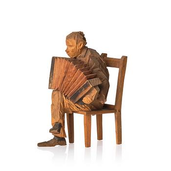 848. Axel Petersson Döderhultarn, Seated Accordionist.