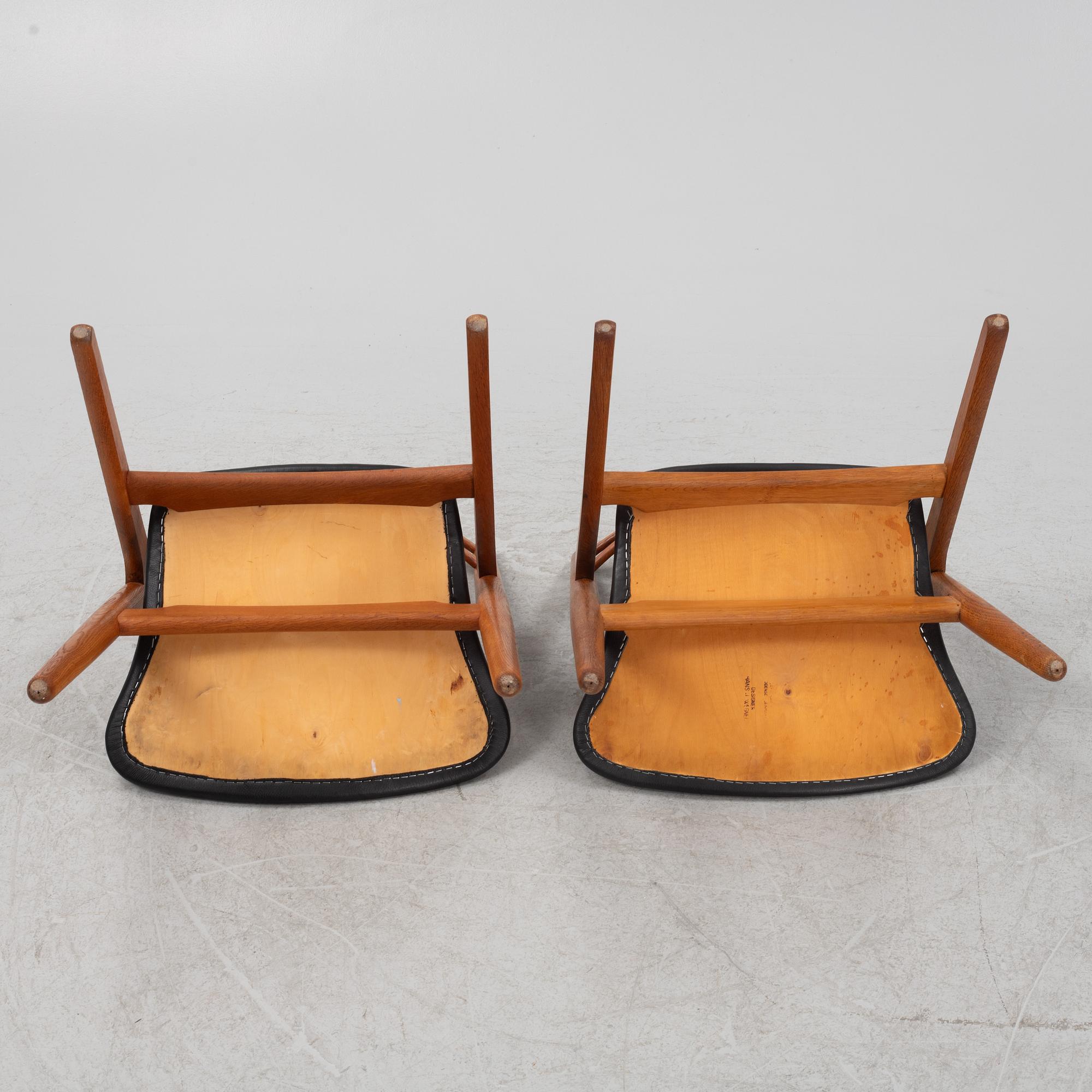 Hans J Wegner, a pair oak and teak CH29 'Savbukkestolen' chairs,Carl Hansen, mid 20th century.