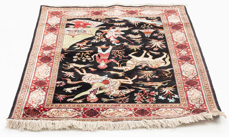 A silk rug, possibly Ghom, c 150 x 102 cm.