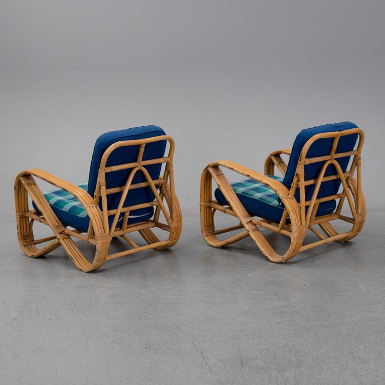 A pair of bamboo and rattan easy chairs, second half of the 20th Century.