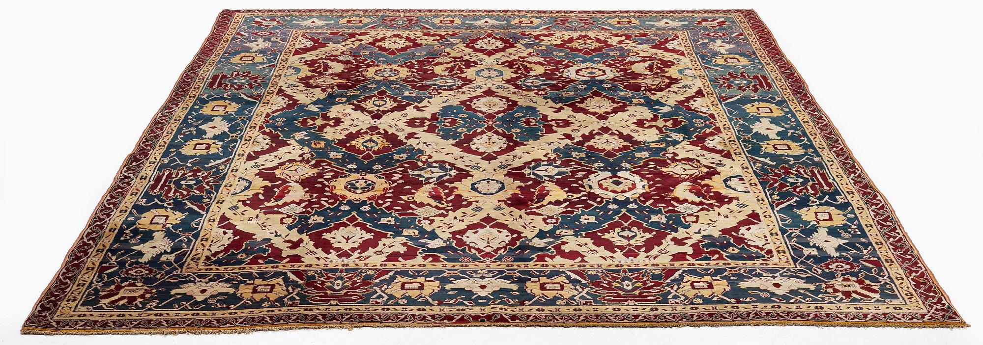 An Antique Agra carpet of 'Dragon Lattice' design, North India, 375 x 298 cm.