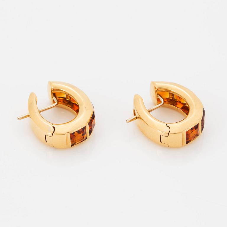 A pair of 18K gold earrings set with step-cut citrines.