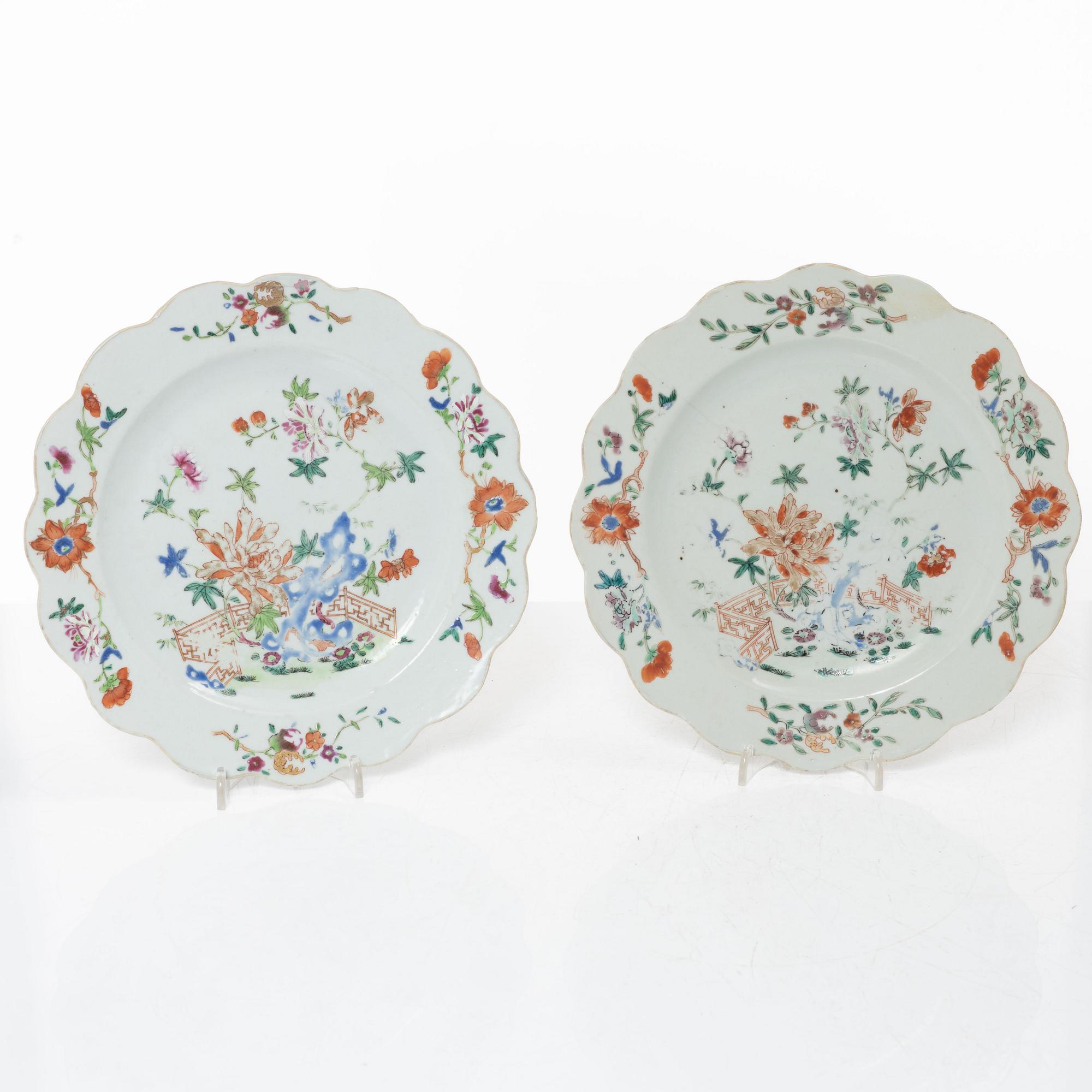 A pair of Chinese famille rose teacups with saucers and a pair of plates and two dishes, Qing dynasty, 18th century.