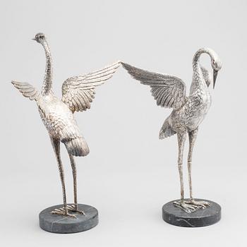 A pair of Spanish silver figurines, unmarked  receipt is included.