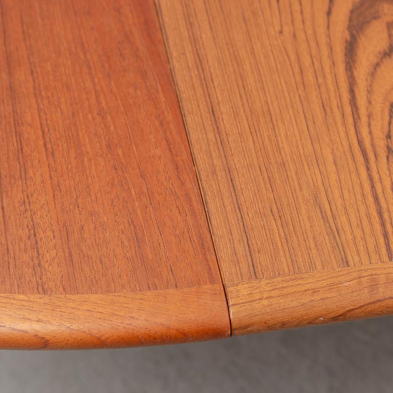 A 1960s teak veneered dining table.
