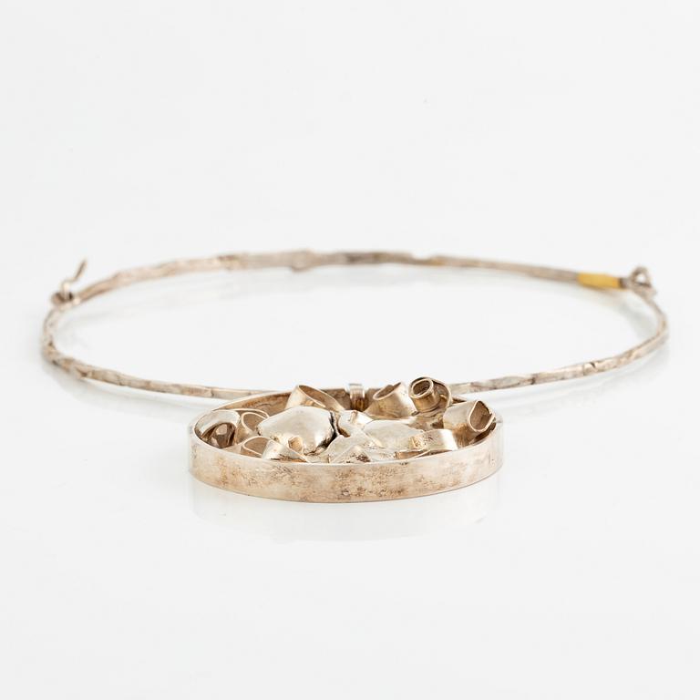 Lars Arby, three neck rings with pendants, silver, Gothenburg including 1977, 1978, and 1982.