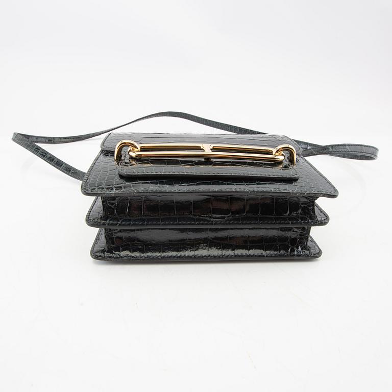 Hermès, bag "Green Shiny Alligator Mini Roulis 18 Permabrass Hardware" 2021.