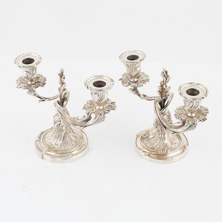 A rococo style pair of silverplated candelabras, end of the 19th Century..
