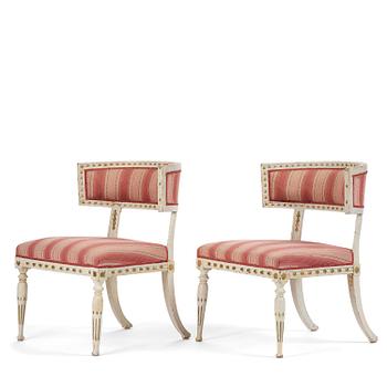 71. A pair of late Gustavian Klismos chairs by E- Ståhl (master in Stockholm 1794-1820).